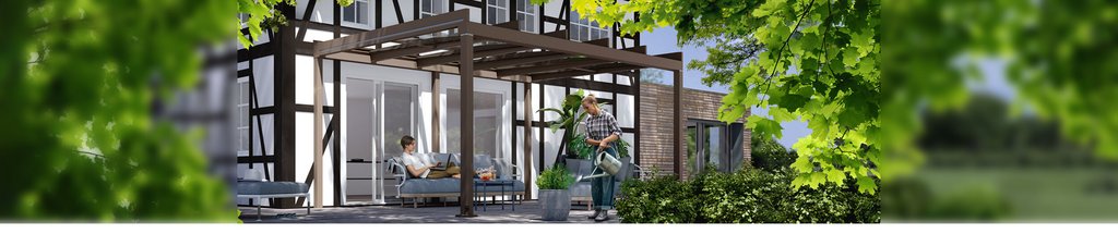 Gemütliche Terrassensituation unter einer kubischen Überdachung an einem Fachwerkhaus mit grünen Pflanzen im Vordergrund. Gemütliche Terrassensituation unter einer kubischen Überdachung an einem Fachwerkhaus mit grünen Pflanzen im Vordergrund.